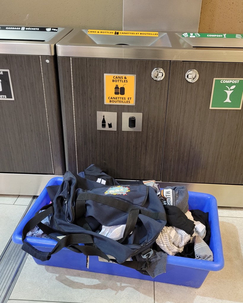 Pile of clothes left at Calgary International Airport after the luggage was overweight