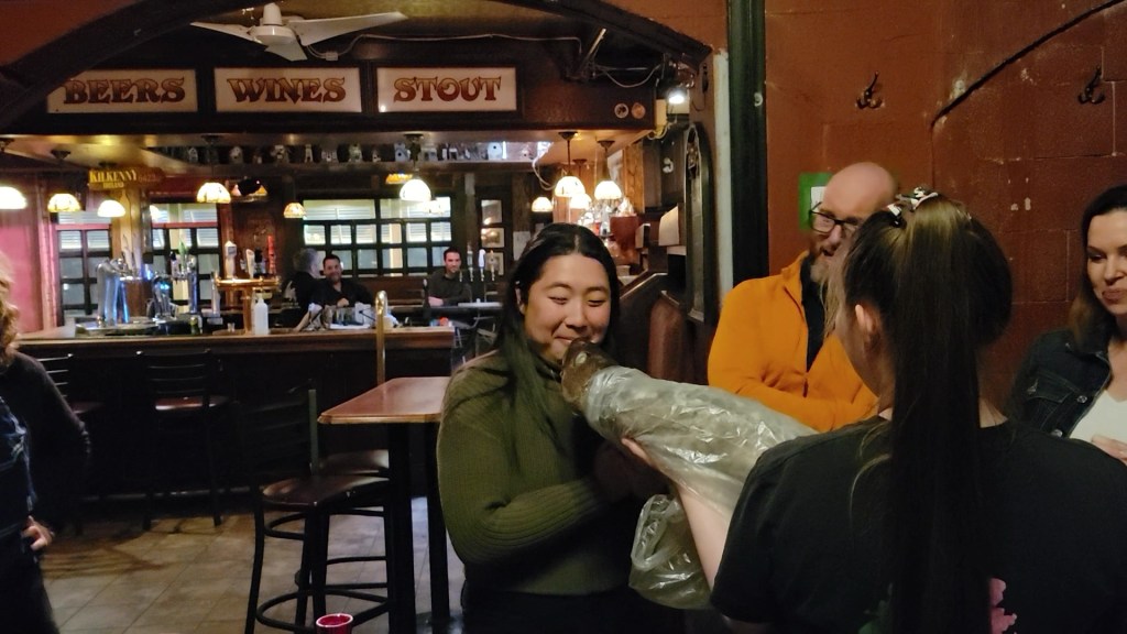 Kissing a cod at the screech-in ceremony at O'Reilly's pub in St. John's