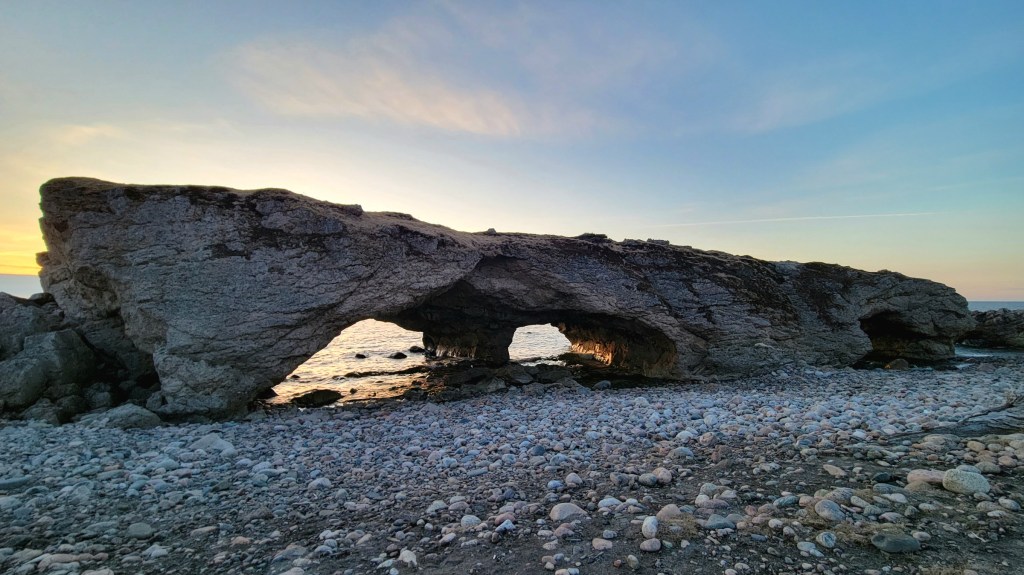 Sea arches at The Arches Provincial Park at sunset
