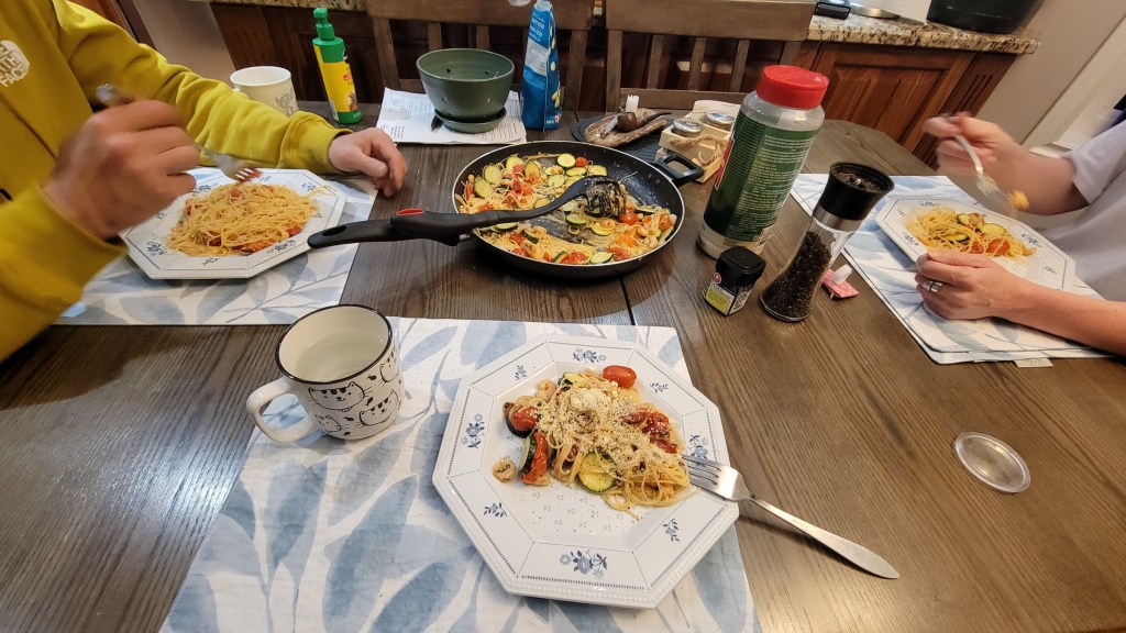 Home-cooked pasta dinner with shrimp and vegetables in Stephenville