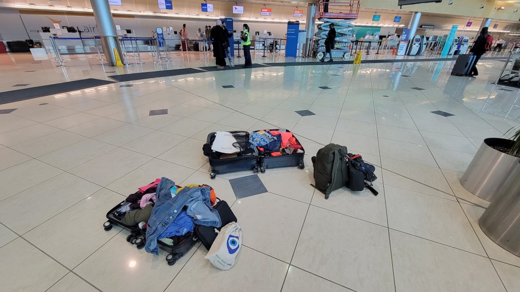 Luggage at St. John's airport after donating clothes to Goodwill
